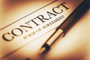 "Professional signing a contract, symbolizing reliable and trustworthy contract solutions for securing future agreements."